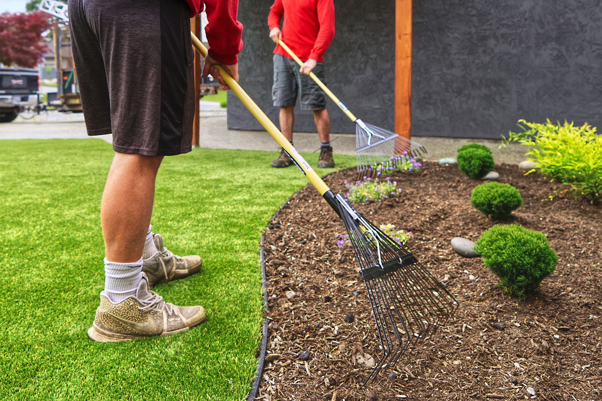Mulch and lawn care service improving flower beds in Aurora Illinois